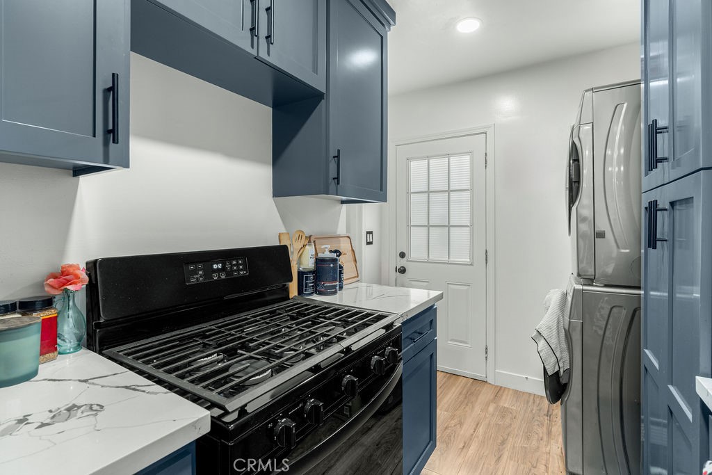 2015 Wayside Street Compton, CA 90222 - Photo 13 of 27 a stove top oven sitting inside of a kitchen