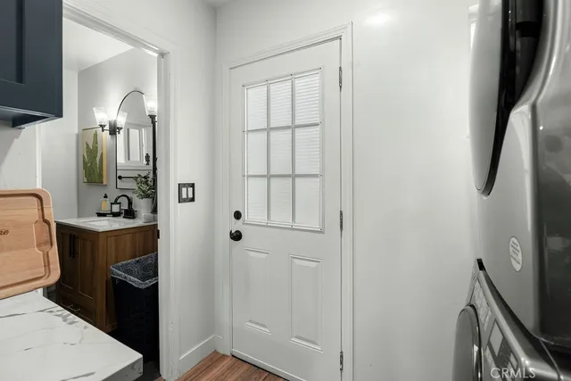 a bathroom with a sink a toilet and shower a mirror