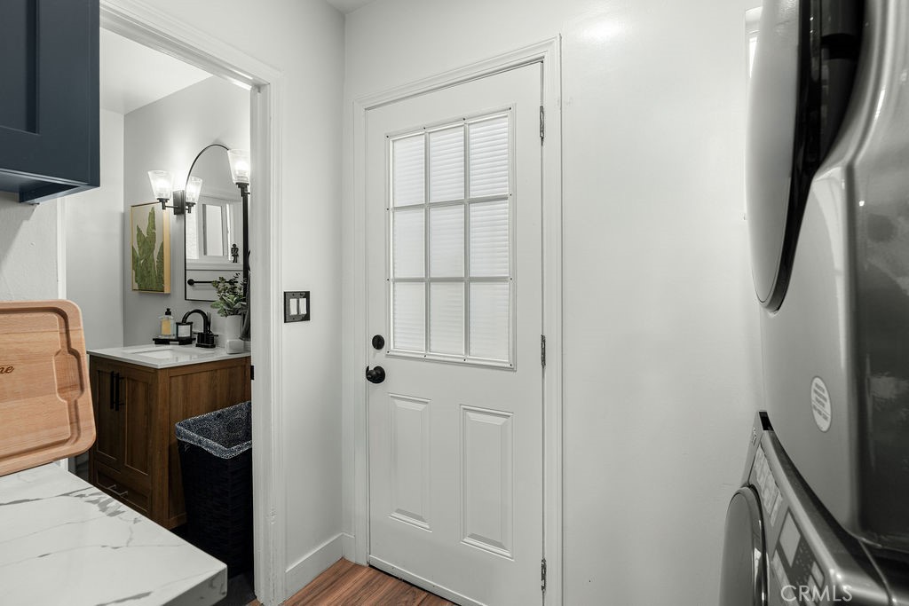 2015 Wayside Street Compton, CA 90222 - Photo 14 of 27 a bathroom with a sink a toilet and shower a mirror