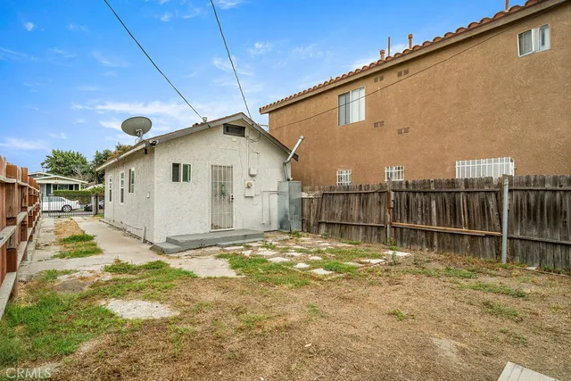 a backyard of a house with a yard and garage