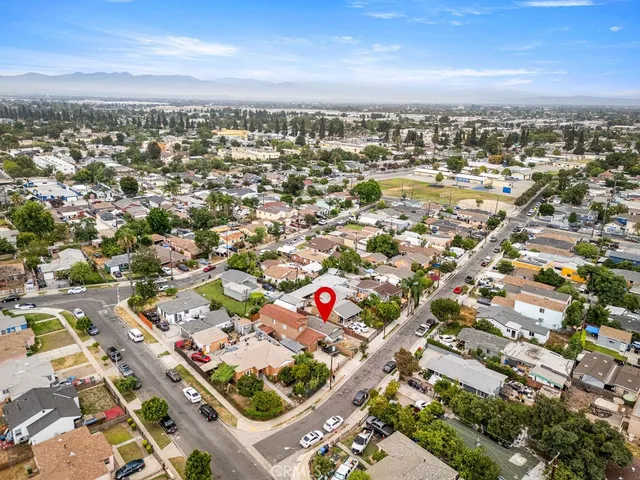 an aerial view of residential building with parking