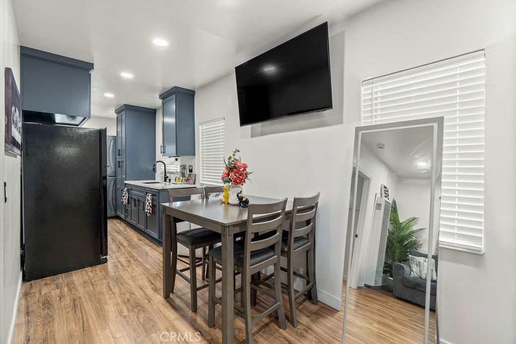 2015 Wayside Street Compton, CA 90222 - Photo 5 of 27 a view of a dining room with furniture and wooden floor