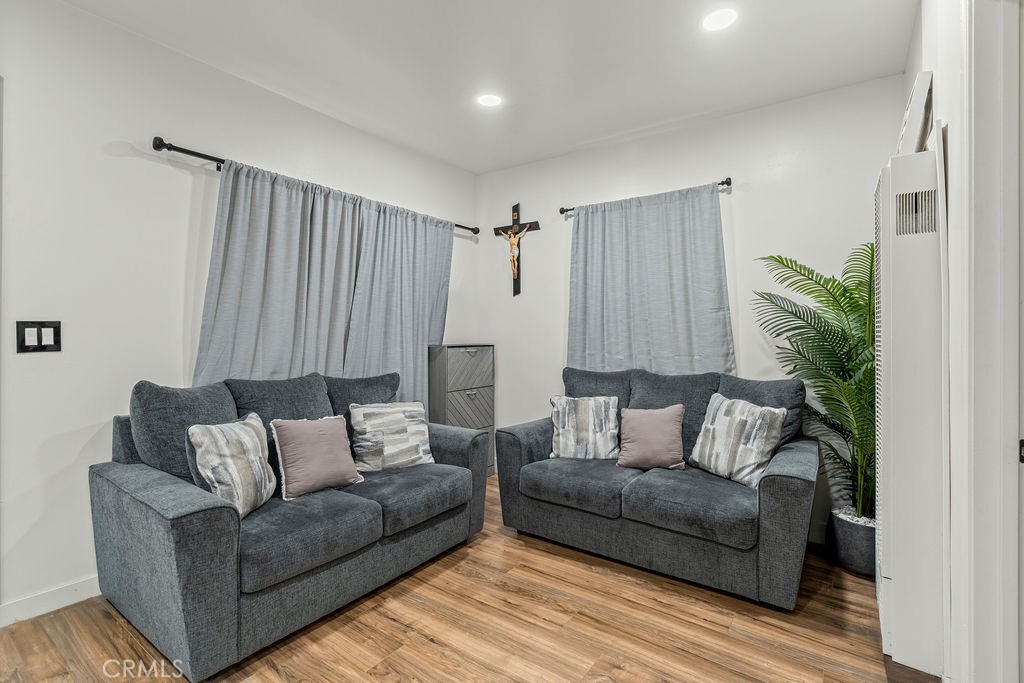 2015 Wayside Street Compton, CA 90222 - Photo 7 of 27 a living room with furniture and a potted plant
