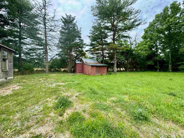 a view of a backyard with a garden