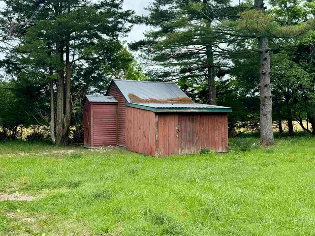 a view of a back yard of the house