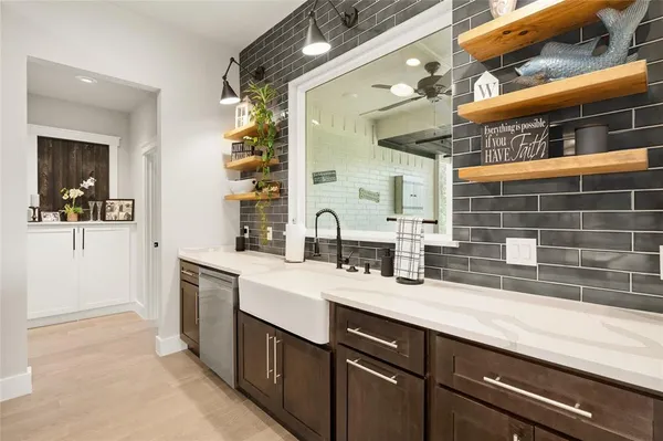 a bathroom with a double vanity sink and a mirror