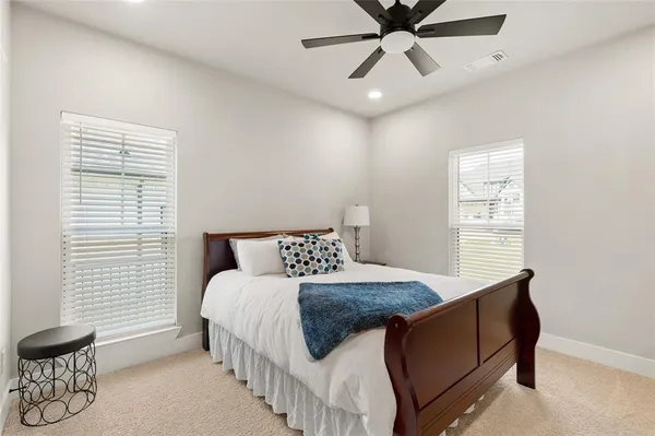 a bedroom with a bed and window