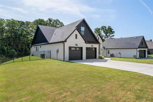 a view of a house with pool and yard