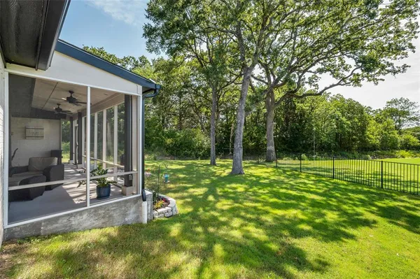 a view of a backyard with a garden and plants