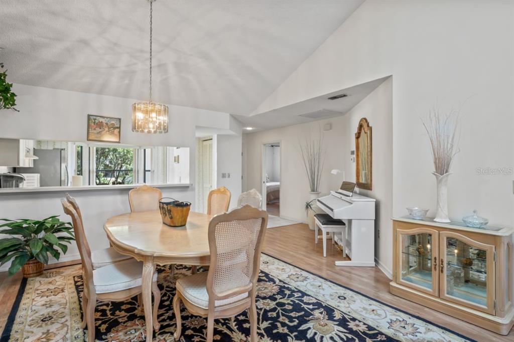 3274 Lori Lane, Unit 2 New Port Richey, FL 34655 - Photo 13 of 56 a view of a dining room with furniture window and wooden floor