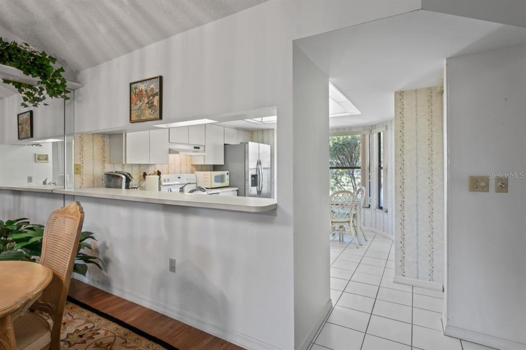 3274 Lori Lane, Unit 2 New Port Richey, FL 34655 - Photo 14 of 56 a kitchen with stainless steel appliances a refrigerator and cabinets
