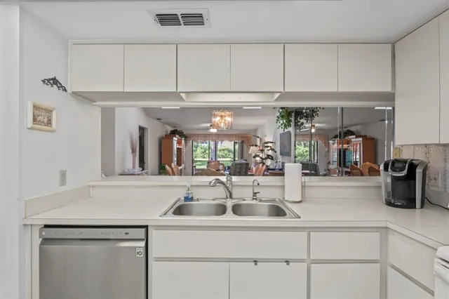 a dining room with furniture and a window