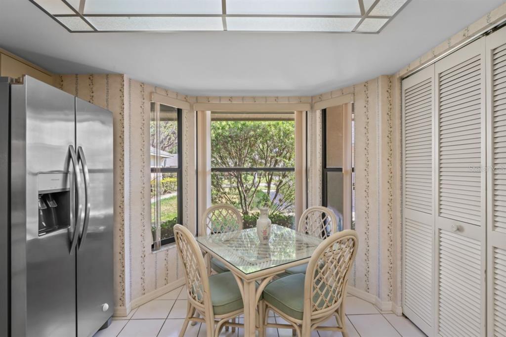 3274 Lori Lane, Unit 2 New Port Richey, FL 34655 - Photo 18 of 56 a dining room with furniture and a window