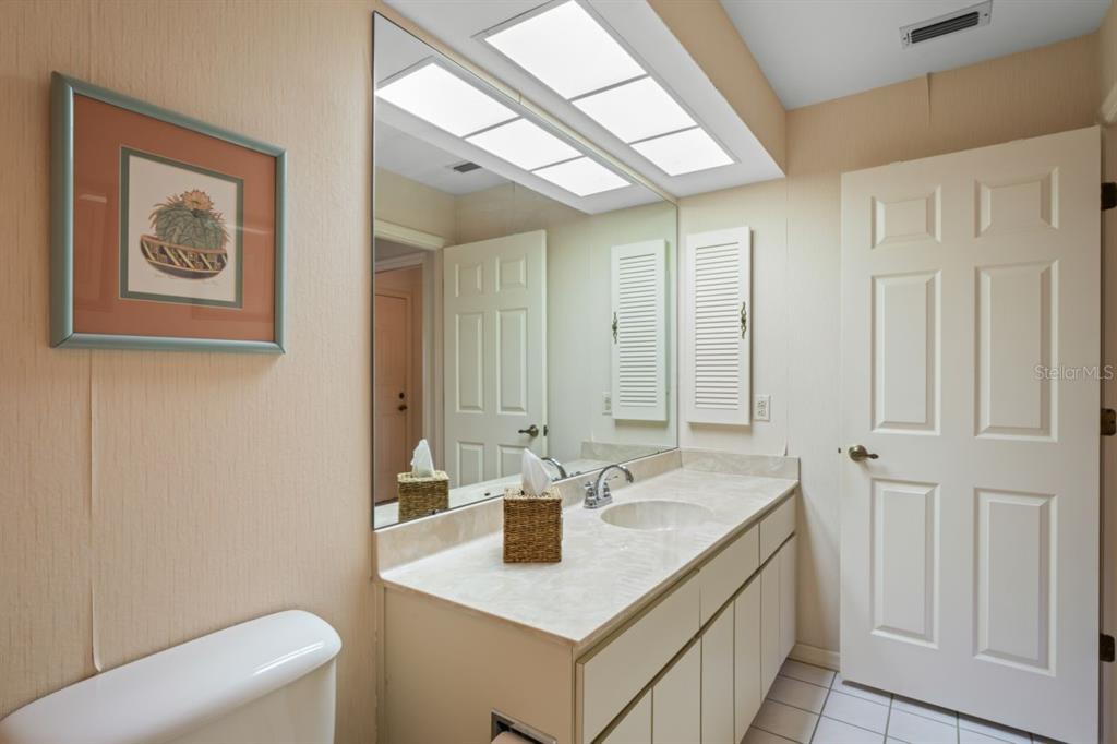 3274 Lori Lane, Unit 2 New Port Richey, FL 34655 - Photo 24 of 56 a bathroom with a sink and a mirror