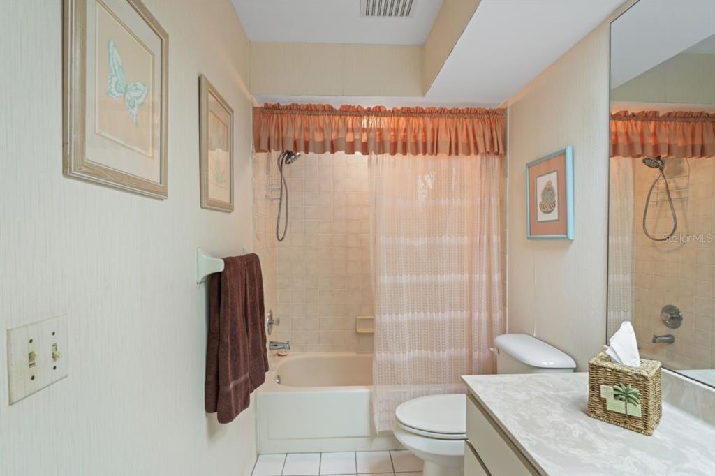 3274 Lori Lane, Unit 2 New Port Richey, FL 34655 - Photo 26 of 56 a bathroom with a sink a toilet and shower