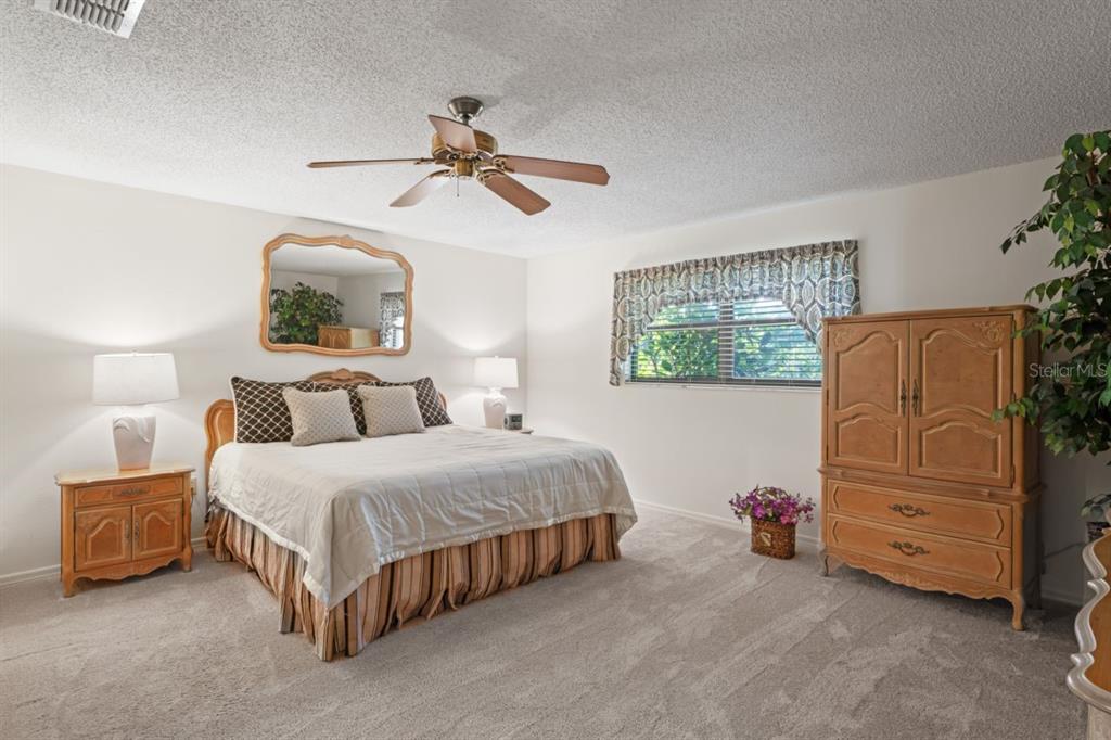 3274 Lori Lane, Unit 2 New Port Richey, FL 34655 - Photo 27 of 56 a bedroom with bed and window