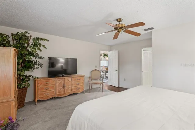a bathroom with a bathtub shower sink and mirror