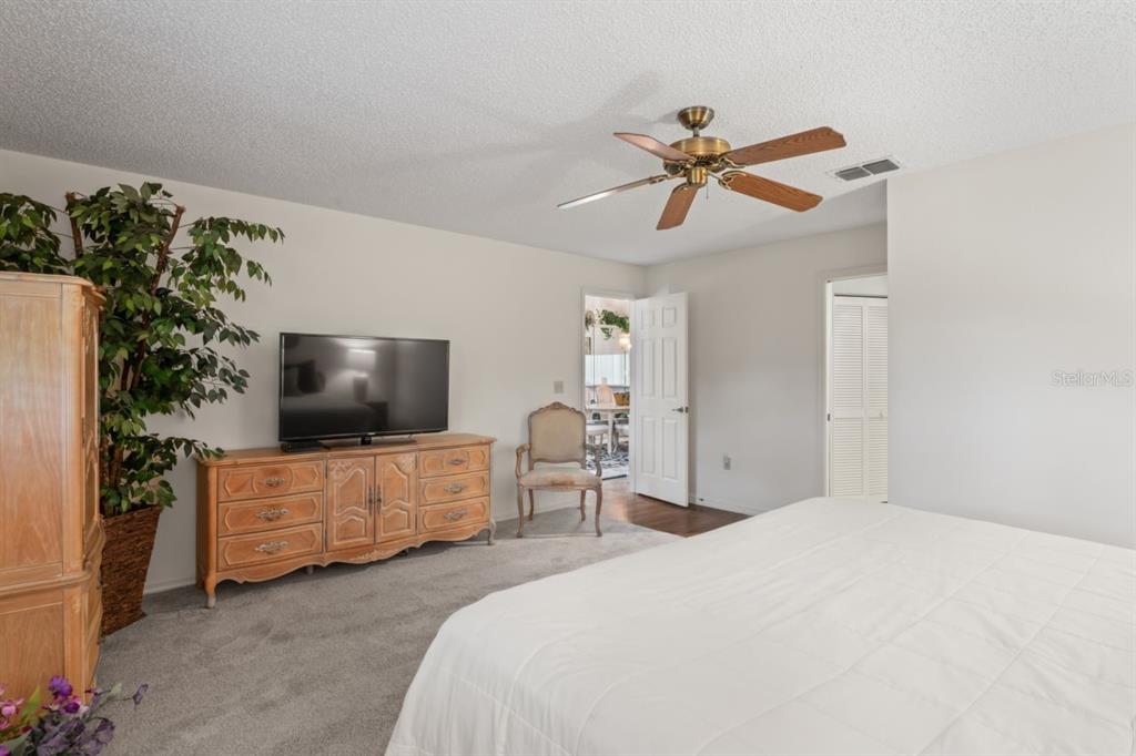 3274 Lori Lane, Unit 2 New Port Richey, FL 34655 - Photo 30 of 56 a bedroom with furniture and a flat screen tv