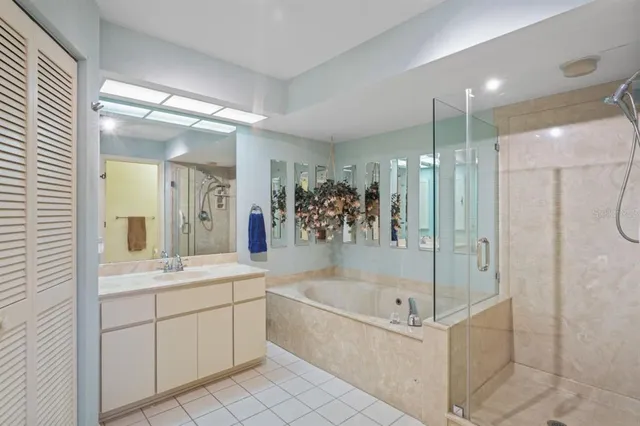 a bathroom with a bathtub sink and mirror