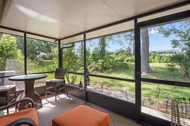 an aerial view of a house with swimming pool garden and patio