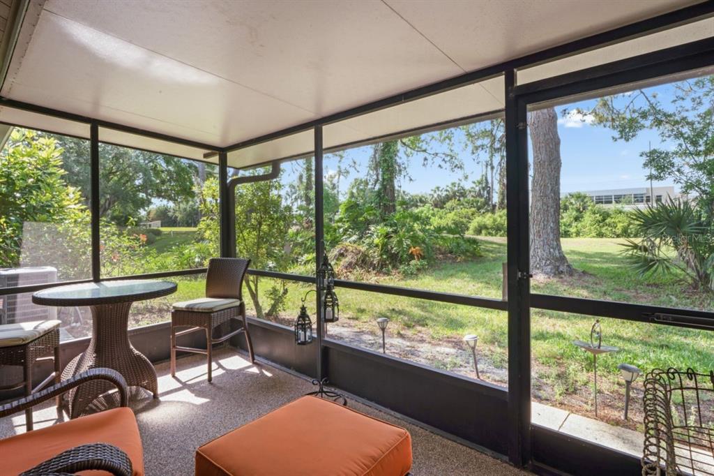 3274 Lori Lane, Unit 2 New Port Richey, FL 34655 - Photo 35 of 56 a living room filled with furniture and a large window