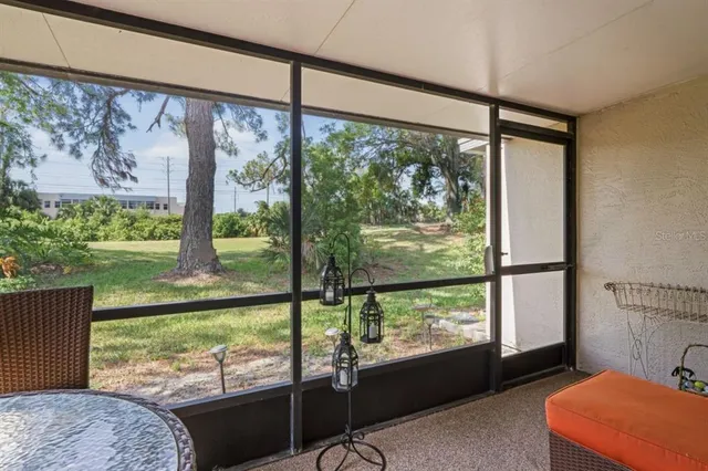 a view of a field with an trees