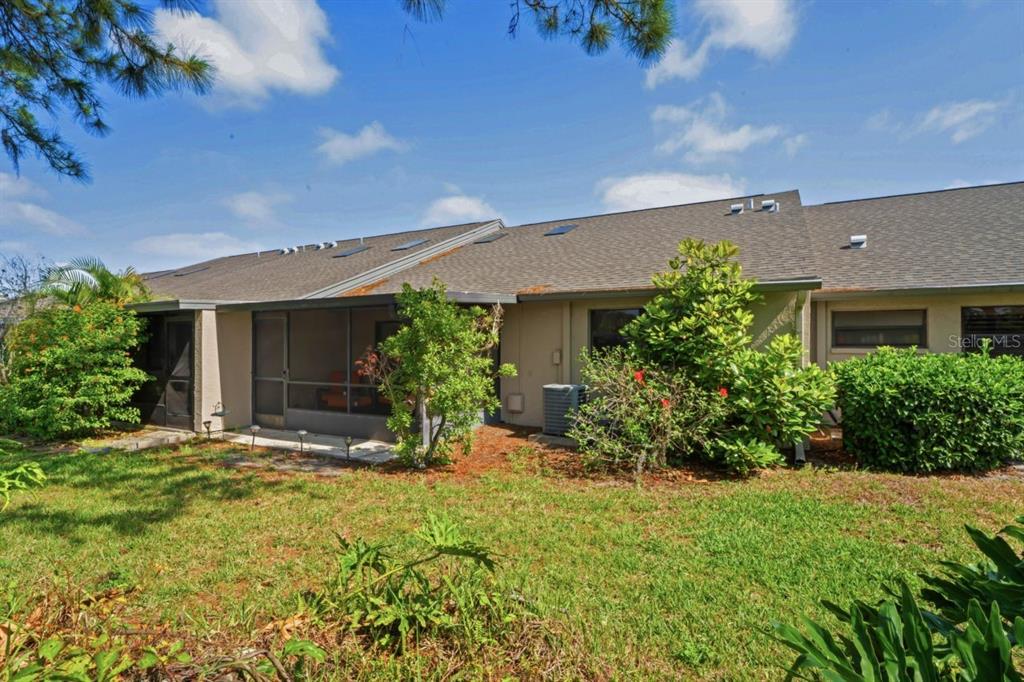 3274 Lori Lane, Unit 2 New Port Richey, FL 34655 - Photo 37 of 56 front view of a house with a yard