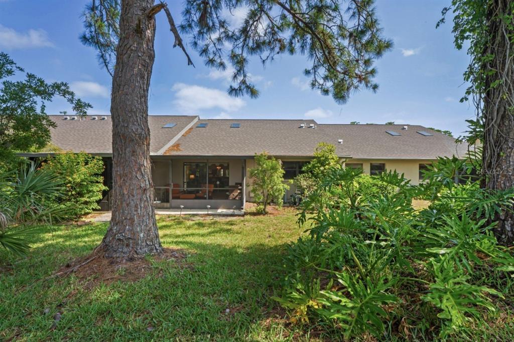 3274 Lori Lane, Unit 2 New Port Richey, FL 34655 - Photo 38 of 56 an aerial view of a house with swimming pool garden and patio