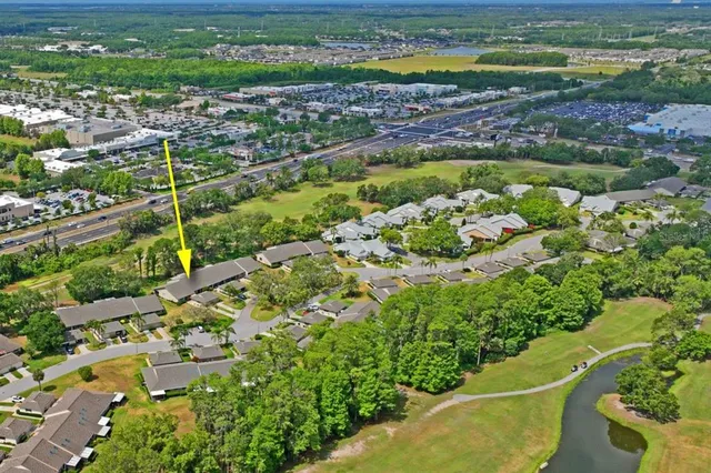 a view of the house with a swimming pool