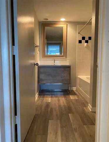 a bathroom with a sink and a mirror