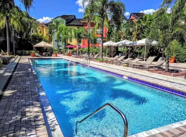 a view of swimming pool with outdoor seating