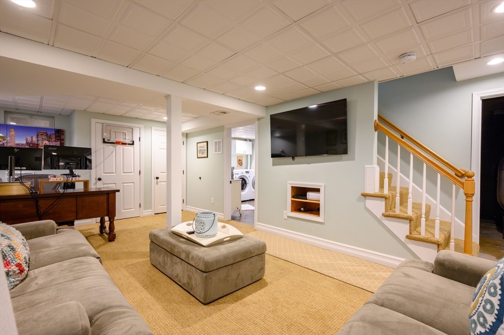 2 Hoover Road Hingham, MA 02043 - Photo 16 of 42 a living room with furniture and a flat screen tv