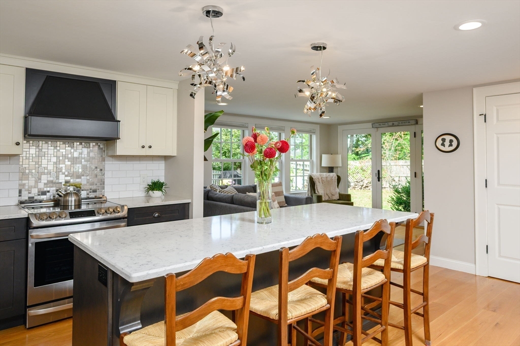2 Hoover Road Hingham, MA 02043 - Photo 2 of 42 a kitchen with a table and chairs in it