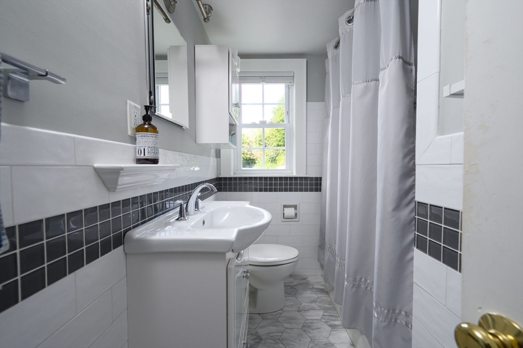 2 Hoover Road Hingham, MA 02043 - Photo 21 of 42 a bathroom with a sink toilet and mirror