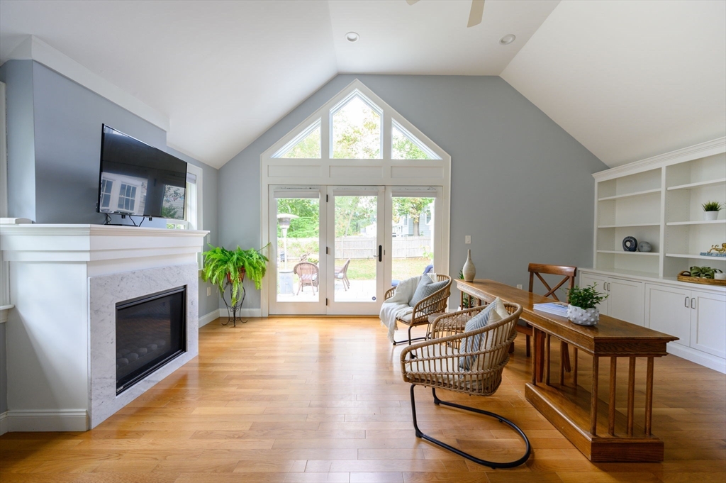 2 Hoover Road Hingham, MA 02043 - Photo 28 of 42 a living room with furniture a flat screen tv and a fireplace