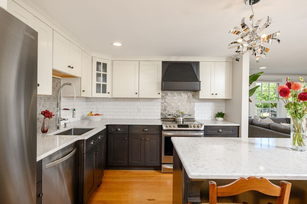 2 Hoover Road Hingham, MA 02043 - Photo 4 of 42 a kitchen with a sink a stove and cabinets