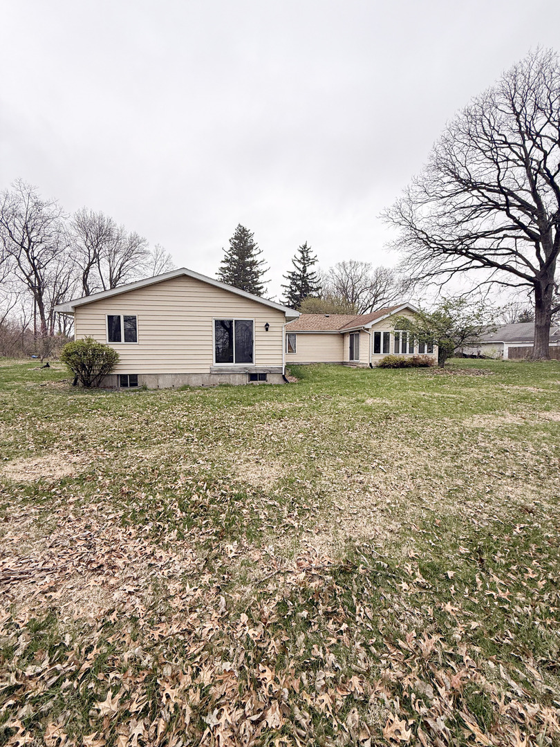 1599 East 2700 North Road Clifton, IL 60927 - Photo 2 of 26 a view of a house with a yard and sitting area