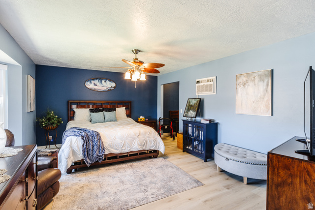 1470 Redwood Tree Street St. George, UT 84790 - Photo 10 of 53 Bedroom featuring wood-finish flooring, a ceiling fan with light fixture, and a window with white trim