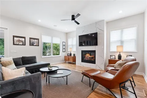 a living room with furniture fireplace and window