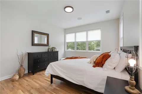 a view of a sink and dishwasher with cabinets