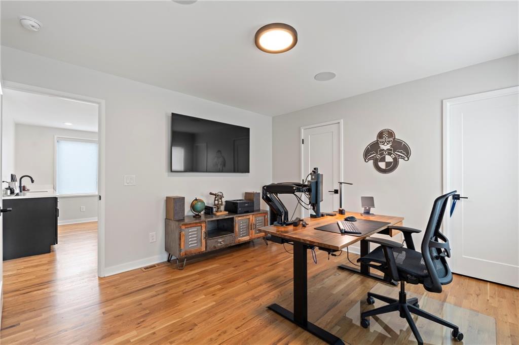 664 B Timm Valley Road Northeast Atlanta, GA 30305 - Photo 42 of 61 a view of a dining room with furniture and wooden floor