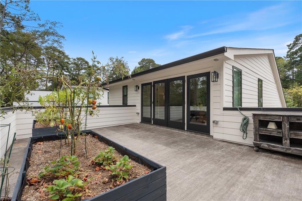 664 B Timm Valley Road Northeast Atlanta, GA 30305 - Photo 45 of 61 a view of a house with a tub in front of it