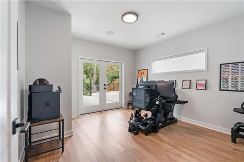 a view of a house with a swimming pool and sitting area