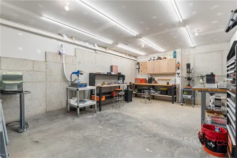 an aerial view of residential house with outdoor space and trees