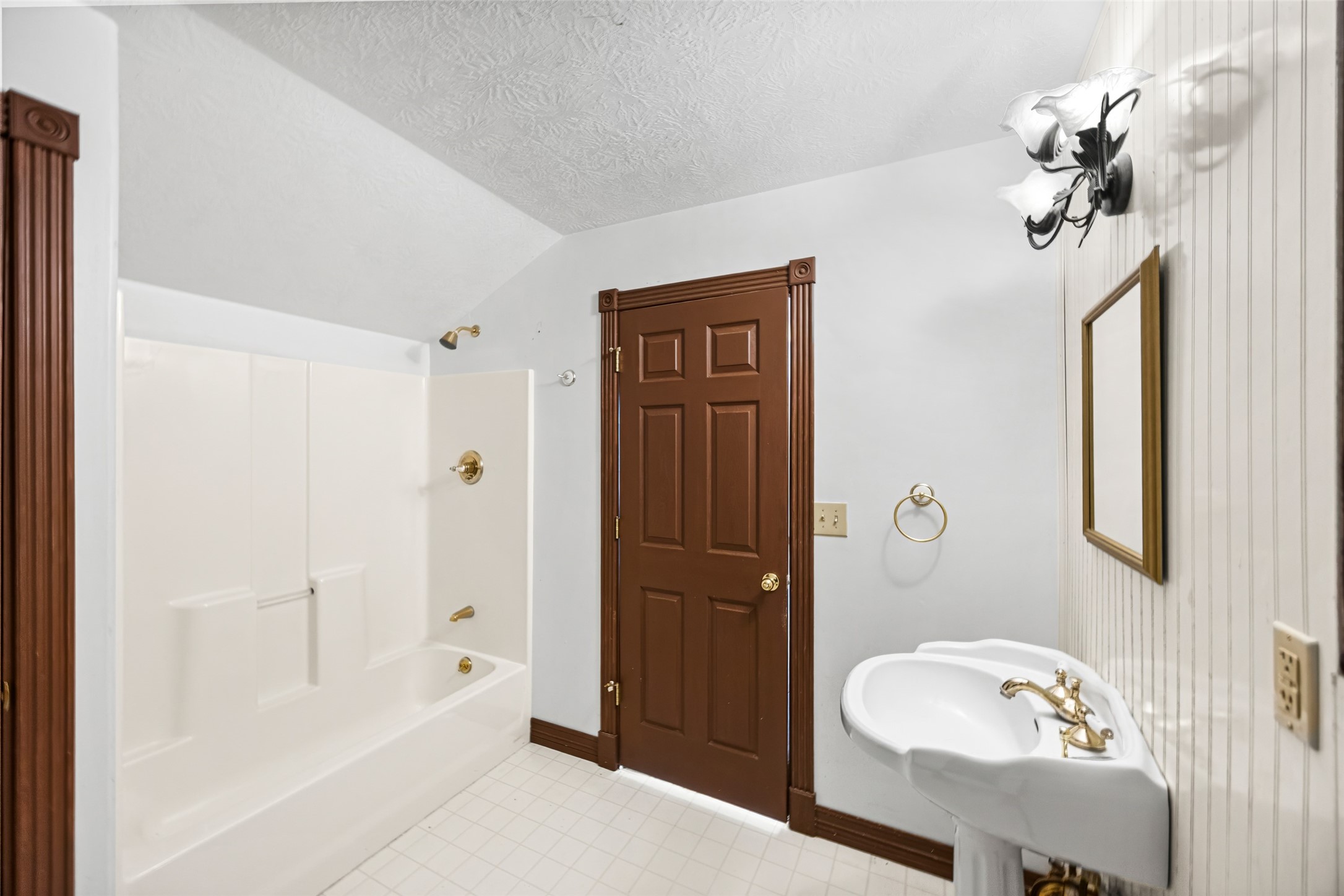 7 Northwood Country Road Huffman, TX 77336 - Photo 29 of 50 a bathroom with a tub shower and a sink