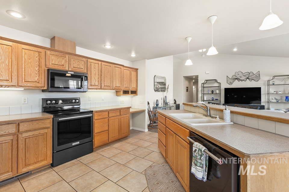 2924 27th Street Clarkston, WA 99403 - Photo 36 of 36 Kitchen with black appliances, light countertops, light tile patterned floors, open floor plan, and recessed lighting