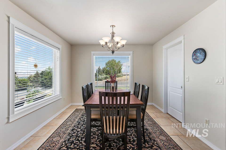 2924 27th Street Clarkston, WA 99403 - Photo 12 of 36 Dining room with a chandelier and light tile patterned flooring