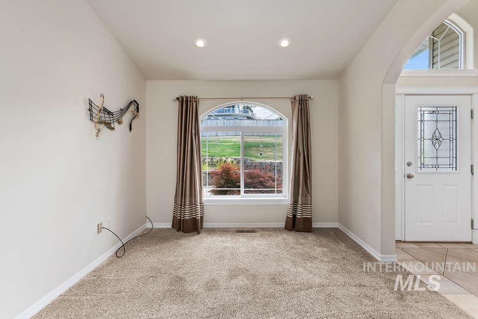 2924 27th Street Clarkston, WA 99403 - Photo 15 of 36 Entrance foyer with healthy amount of natural light, light carpet, recessed lighting, and arched walkways