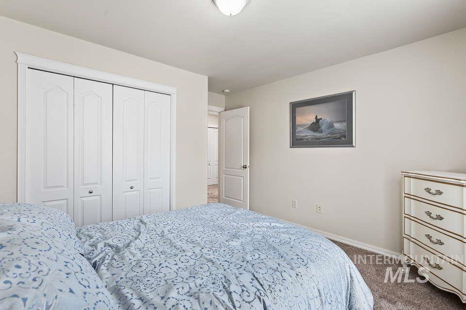 2924 27th Street Clarkston, WA 99403 - Photo 20 of 36 Bedroom featuring dark carpet and a closet