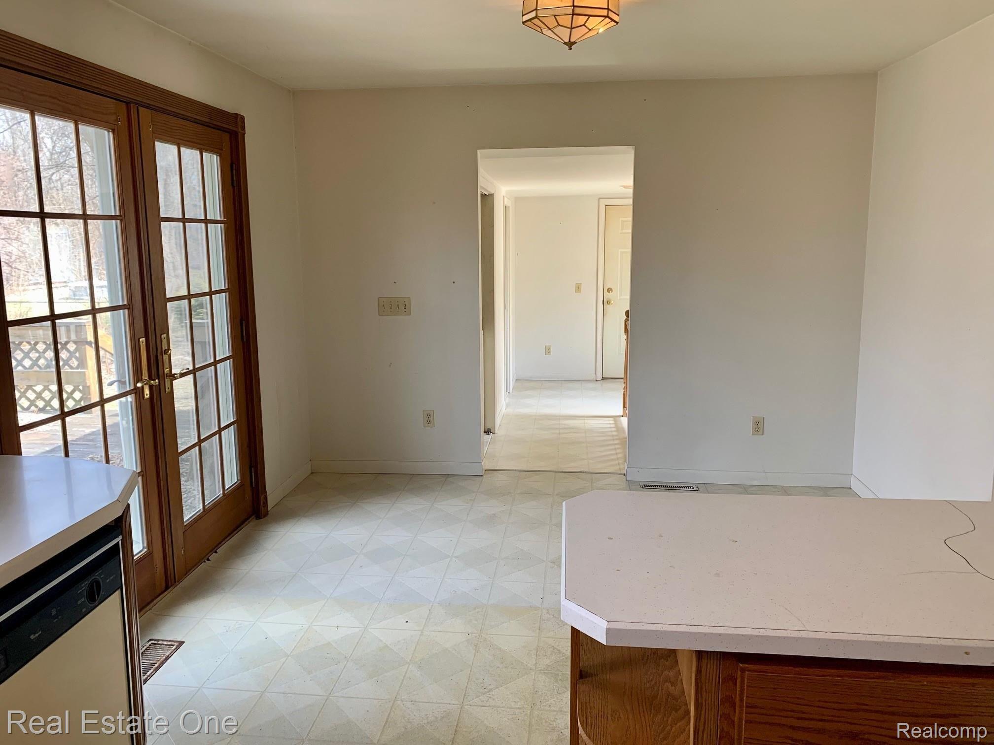 3200 Judah Road Lake Orion, MI 48359 - Photo 5 of 22 Dining area leads to deck